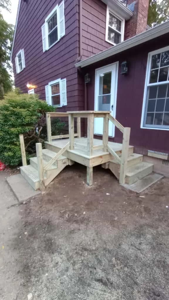 New wood entry steps with railing built by WS Construction